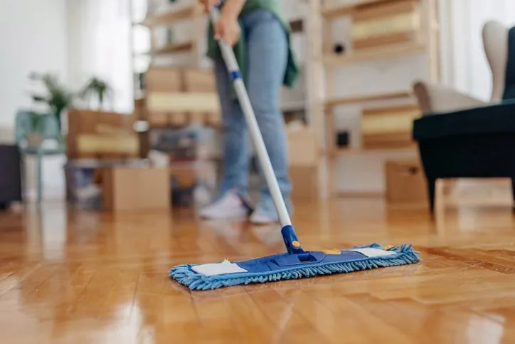 Woman mopping down hardwood floors
