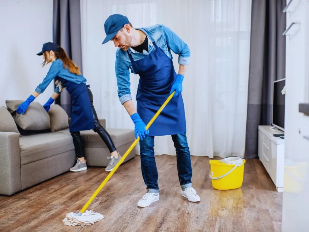 Two cleaners performing move in cleaning for Austin home