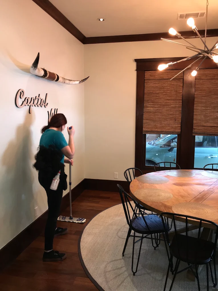 Maid cleaning floors of Austin, TX home